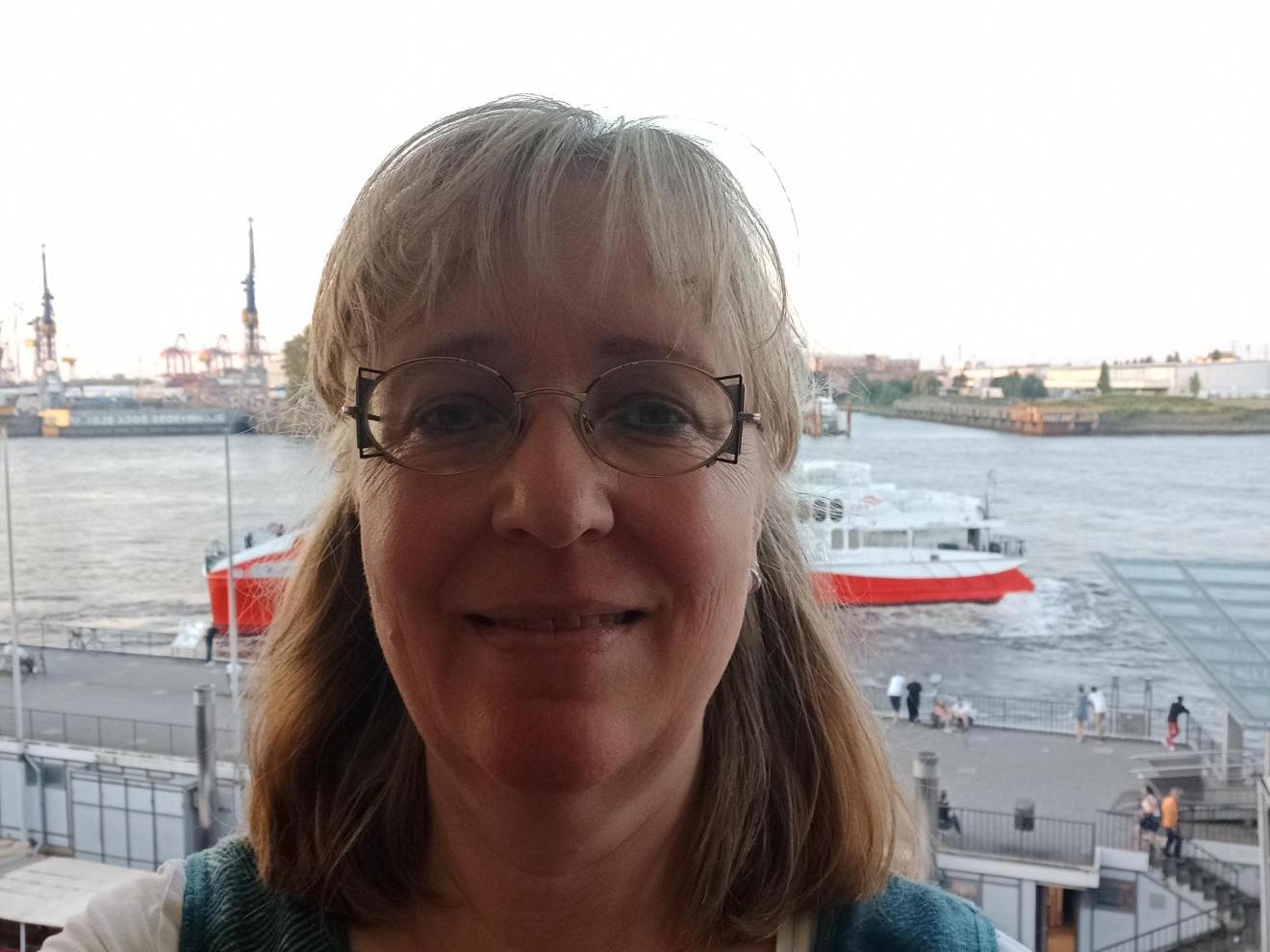 a close up of a person on a boat in the water