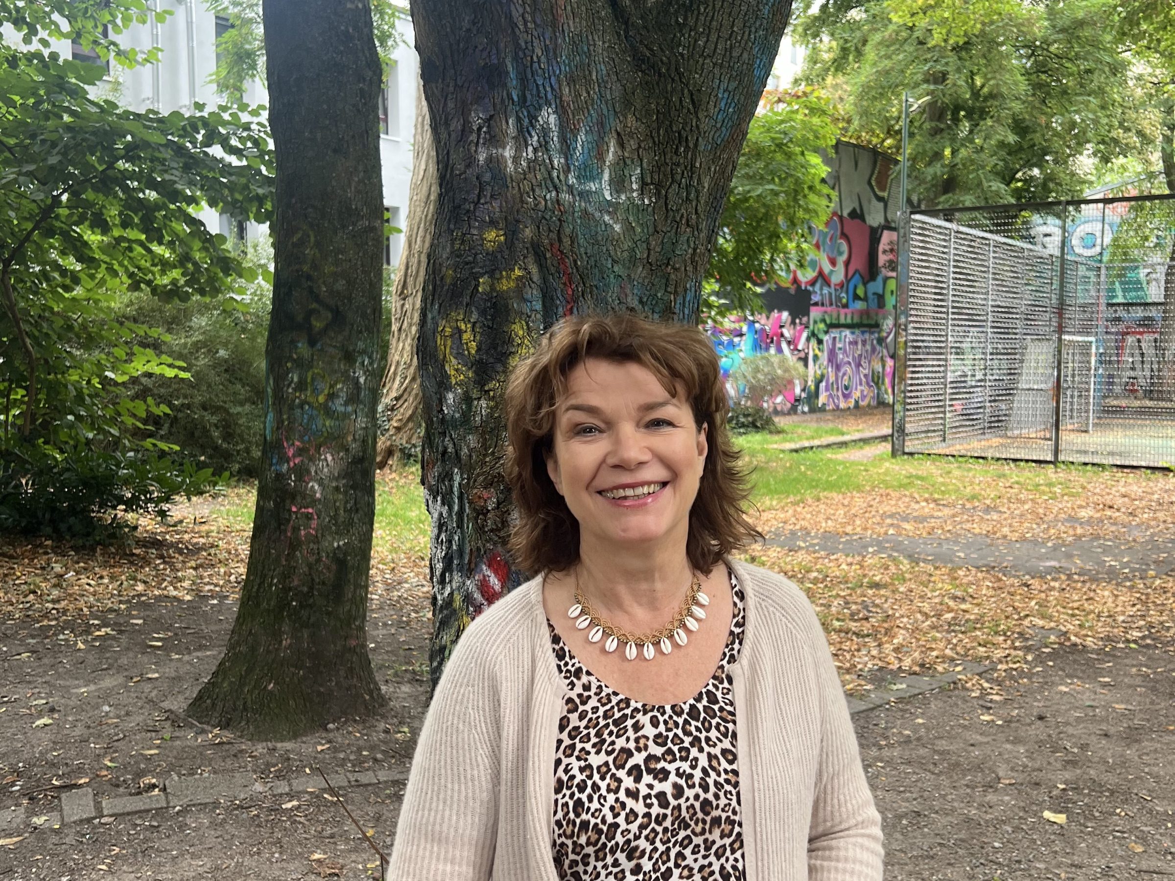 a person standing in front of a tree