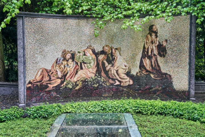 a statue of a person in a garden