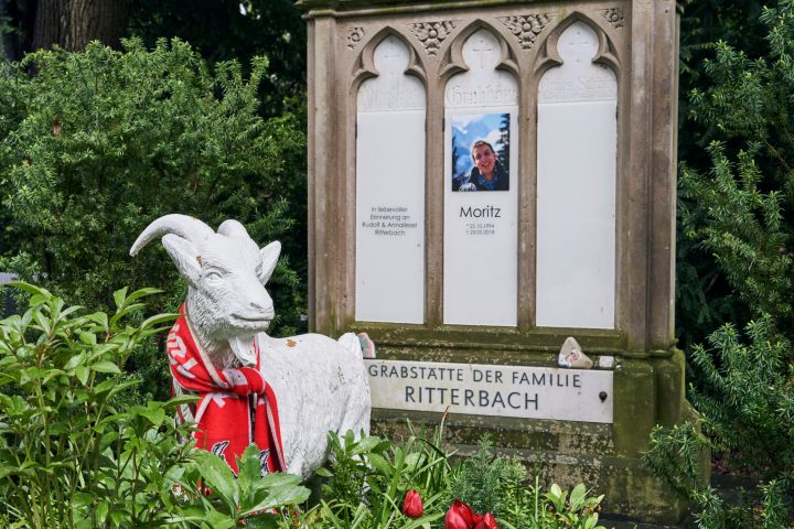 a statue of a flower garden