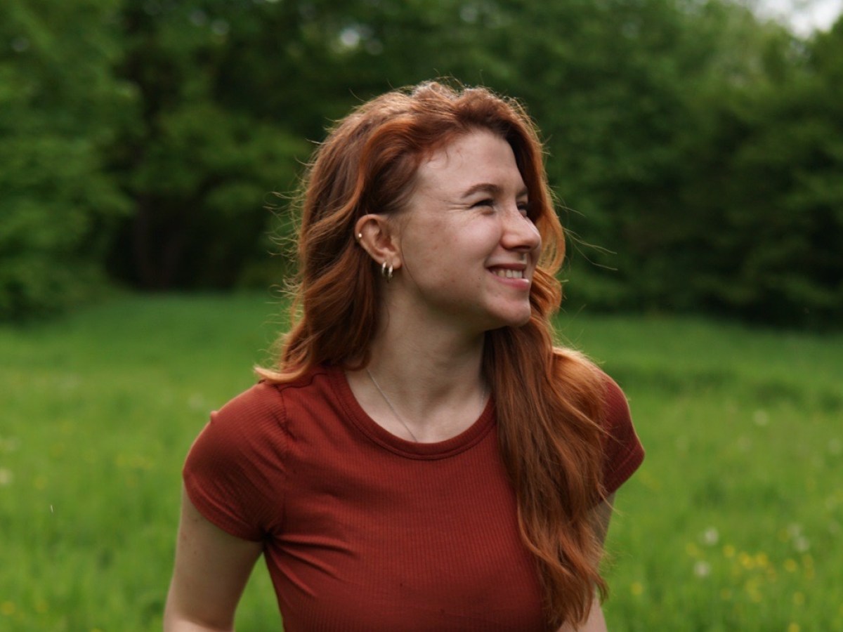 a woman standing in a field