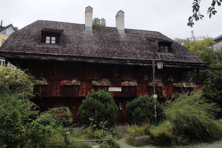 a house with bushes in front of a building