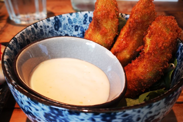 a close up of a plate of food and a cup of coffee