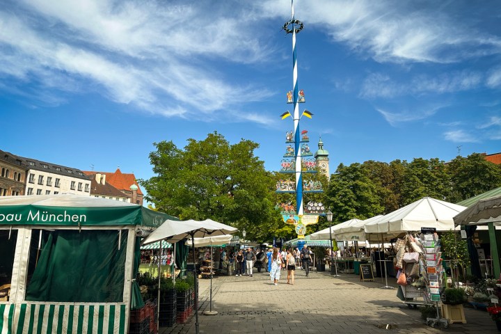 a crowd of people at a bus stop