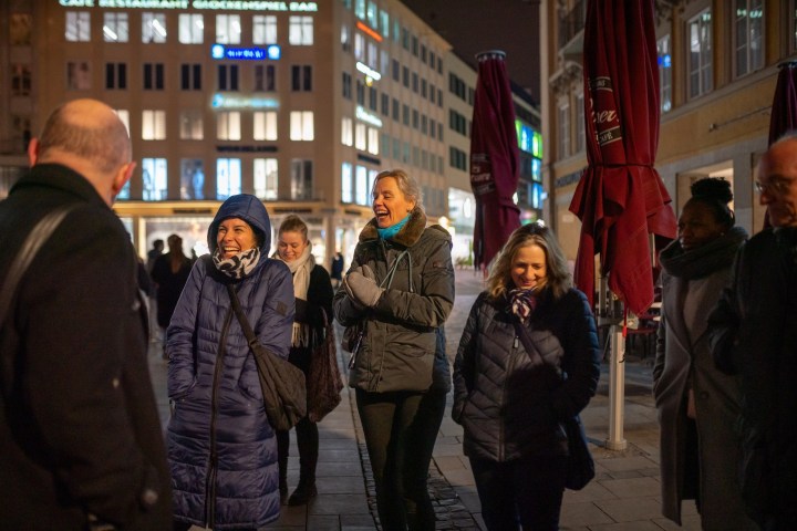 a group of people standing in front of a building