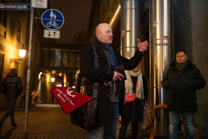 a man and a woman standing in front of a store