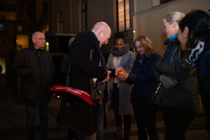a group of people standing in a room
